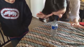 Mom pranks son with water bottle magic trick
