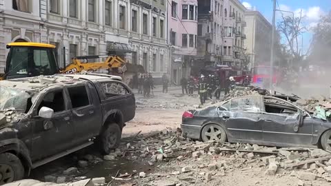 Kharkiv firefighters search rubble after strike