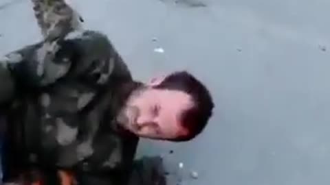 The aftermath of the previous video. Russians POWs after shot and left to bleed