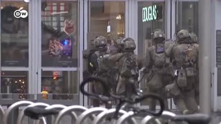 Police stormed shopping center where the man held two hostages