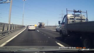 Semi Takes Out Car On Russian Highway