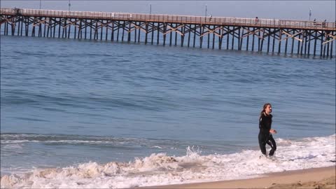 Professional Skimboarder Austin Keen hitting some waves in Seal Beach California.