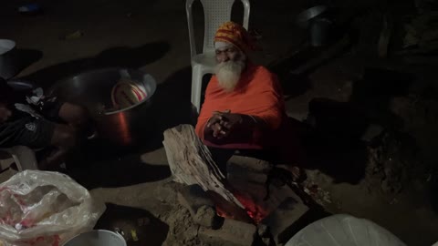 Dayalu Baba Sitting at the Dhuni Fire in the Evening on Makara Sankranti