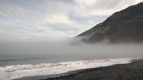 Waves on a Foggy Shore