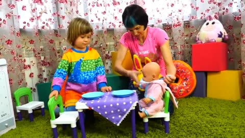 Baby Born Doll & Kids Playing On An Indoor Playground . Toy Slide And Ball pit.