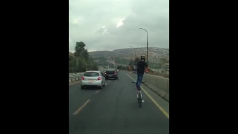 Insane highway bike rider filmed in Israel