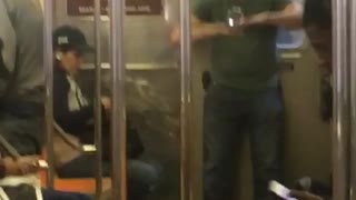 Man plays with fushigi anti gravity ball on subway train