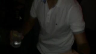 Guy white shirt dancing and holding drink