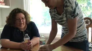 Water bottle prank woman but kid gets wet