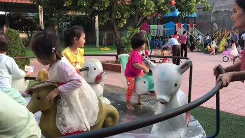children playing in amusement park