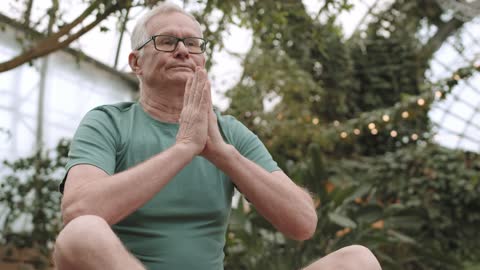 Man Practicing Yoga While Sitting