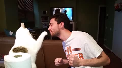 Cat slaps owner when trying to kiss her