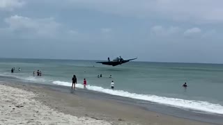 WWII plane forced to crash land on busy Florida beach
