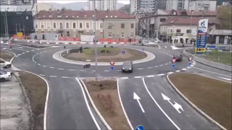 Driver in Serbia has no idea how roundabout works