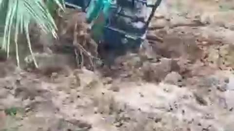 evacuation of the sinking excavator in the swamp