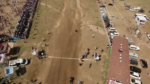 Aerial drone shot finishing line Naadam horse racing in mongolia