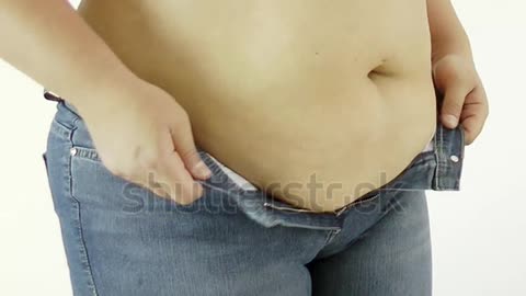 stock-footage-fat-woman-body-trying-to-put-on-her-tight-jeans.webm