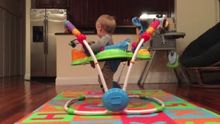 Funny baby jumps like crazy in toy