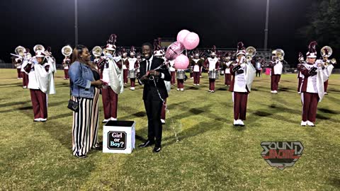 Couple celebrate surprise gender reveal at their old high school