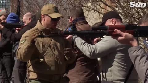 Ukrainian civilians receive military training to defend against Russian army
