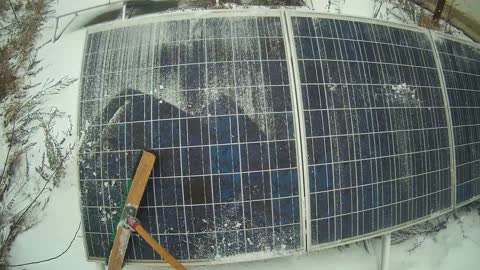 Clearing Solar Panels of Snow. A winter morning in OffGrid life.