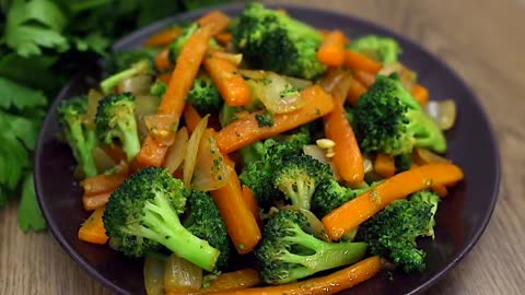 Quick and delicious! Broccoli with carrots in a frying pan.