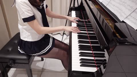 Beauty plays piano while cos