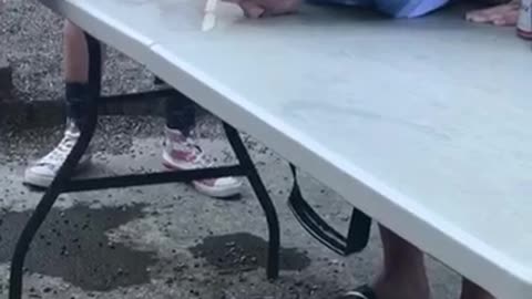 Man drinks spilled beer