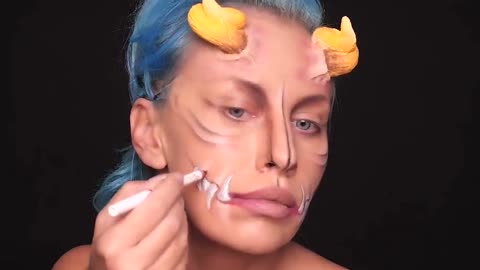 Makeup artist uses horns to complete scary fairy Halloween look