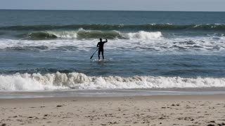 Paddleboard surfing at Assateague
