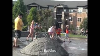 Baby's first time in a splash pad