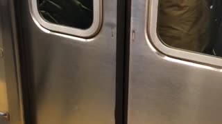 Man gets his jacket snagged in between subway doors