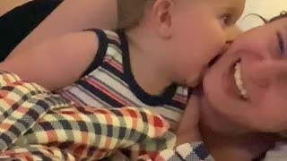 Baby giving mama a 'kiss', so funny!