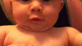 A crying baby notices herself on camera. What happens next will brighten your day!