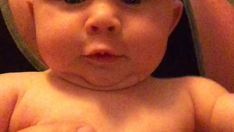 A crying baby notices herself on camera. What happens next will brighten your day!