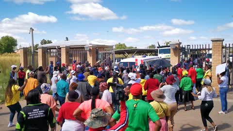 Angry community members outside the Galehewe magistrate's court.