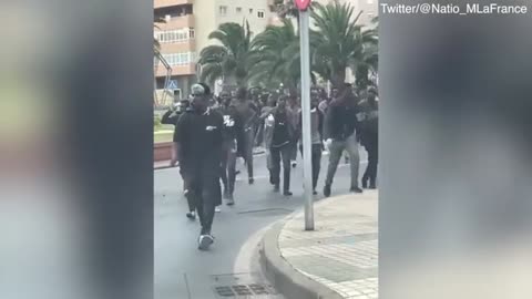 Video: Migrants from Africa run through streets of Spanish exclave Melilla