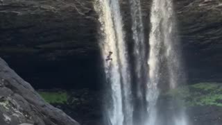 Insane 95ft double backflip off waterfall cliff