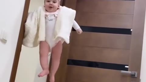 Funny baby playing with balloon