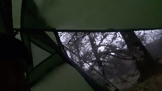 Inside the Bnshe 300. Hail outside. Riverside wildcamping.