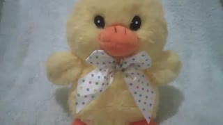 Cute yellow stuffed chick with white bow painted with colorful polka dots [Nature & Animals]