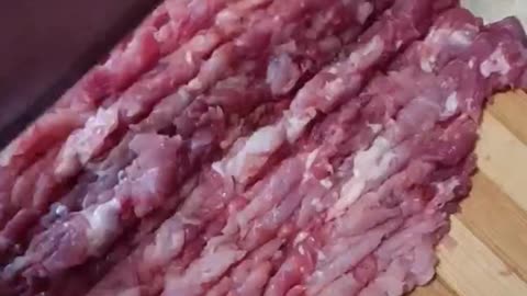 Chopping meat for burgers