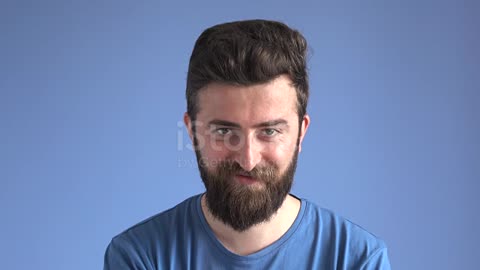 Facial Expression Of Flirting Adult Man On Blue Background