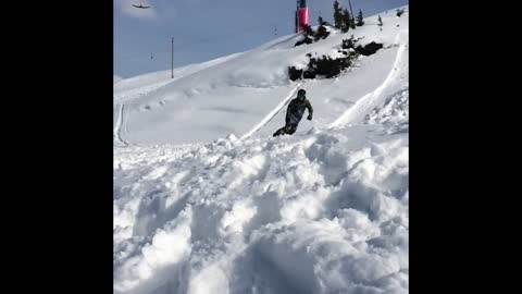 Snowboarder wipes out after landing big jump