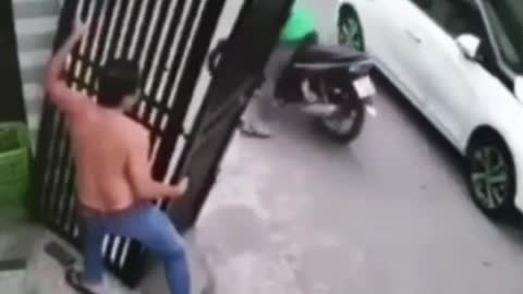 gate would fall on the biker see his reaction later