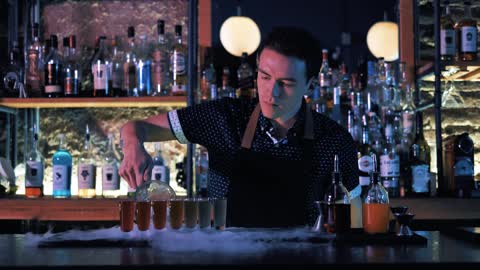 Bartender preparing shots