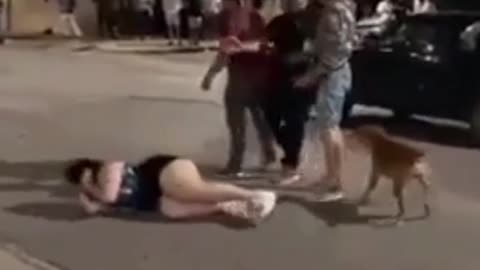 Drunk woman gets dropped after attacking a passing car