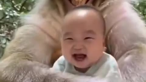 Baby happy with monkey