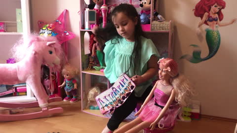 Little Girl Gives Life Size Barbie Doll a Makeover