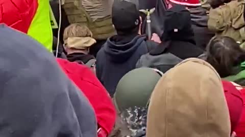 Donald Trump supporters pulling Antifa terrorists away from building.